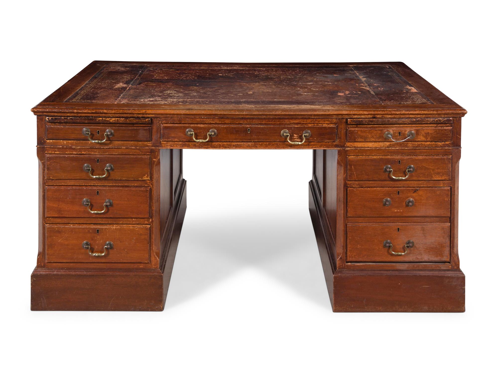 An Edwardian Tooled Leather-Inset Mahogany Partners' Desk