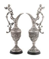 A Pair of Neoclassical Style White Metal Ewers