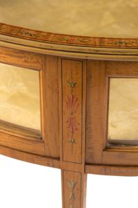 An Edwardian Satinwood and Paint Decorated Demilune Vitrine Table