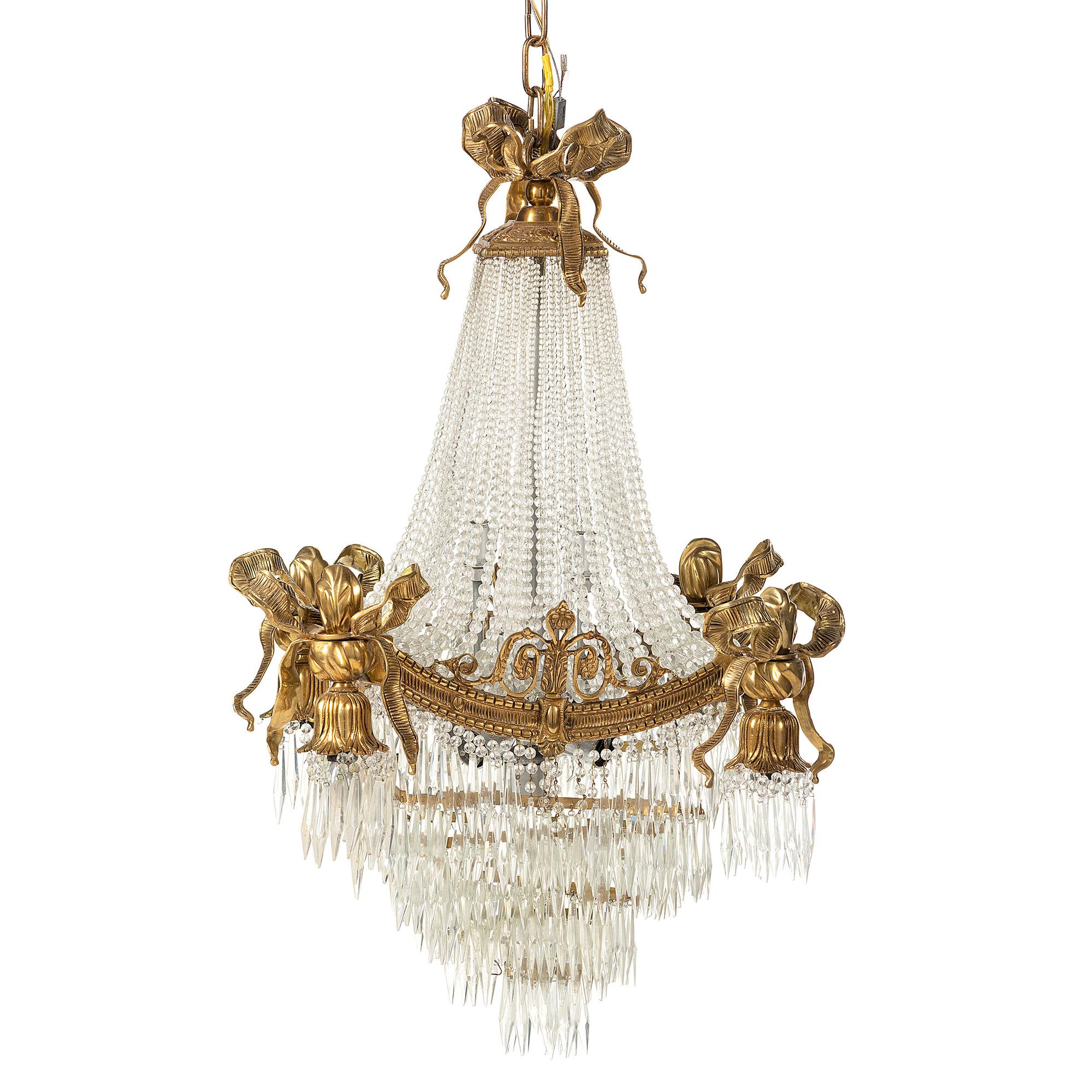 A Louis XVI Style Gilt Metal and Cut Glass Chandelier