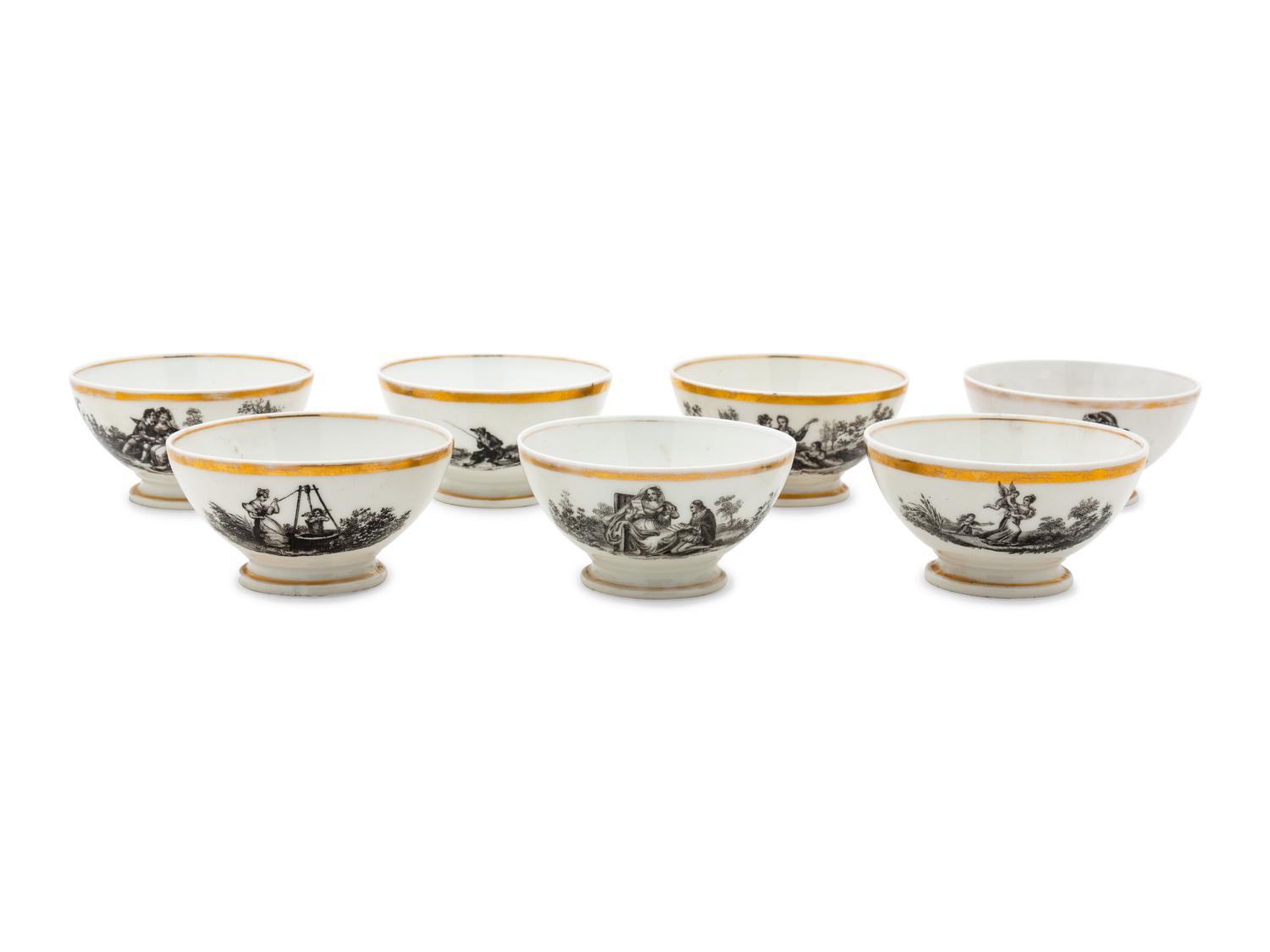 A Collection of Transfer Decorated Cups and Saucers