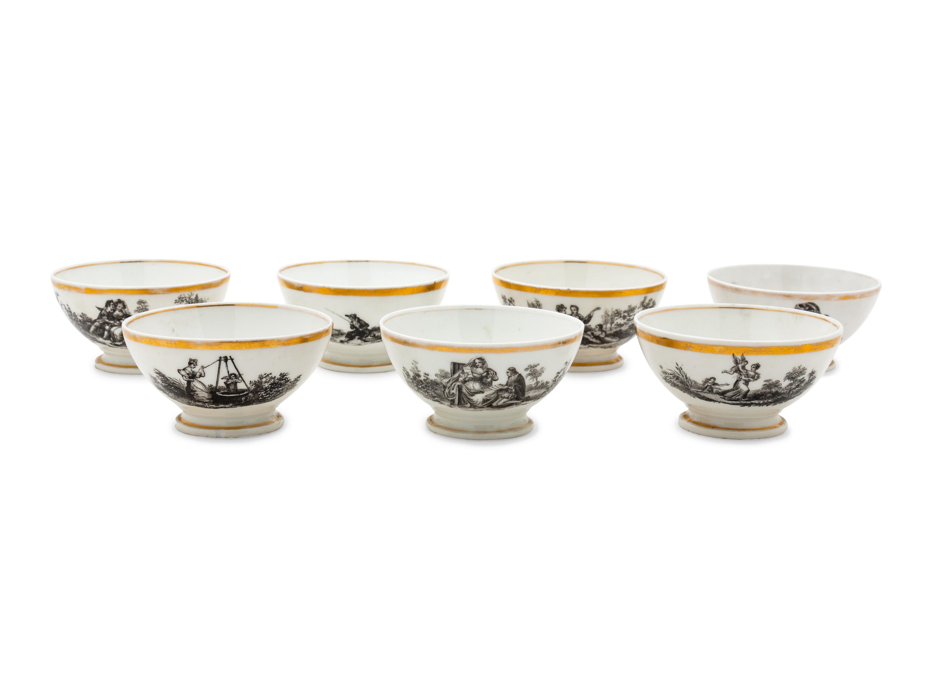 A Collection of Transfer Decorated Cups and Saucers