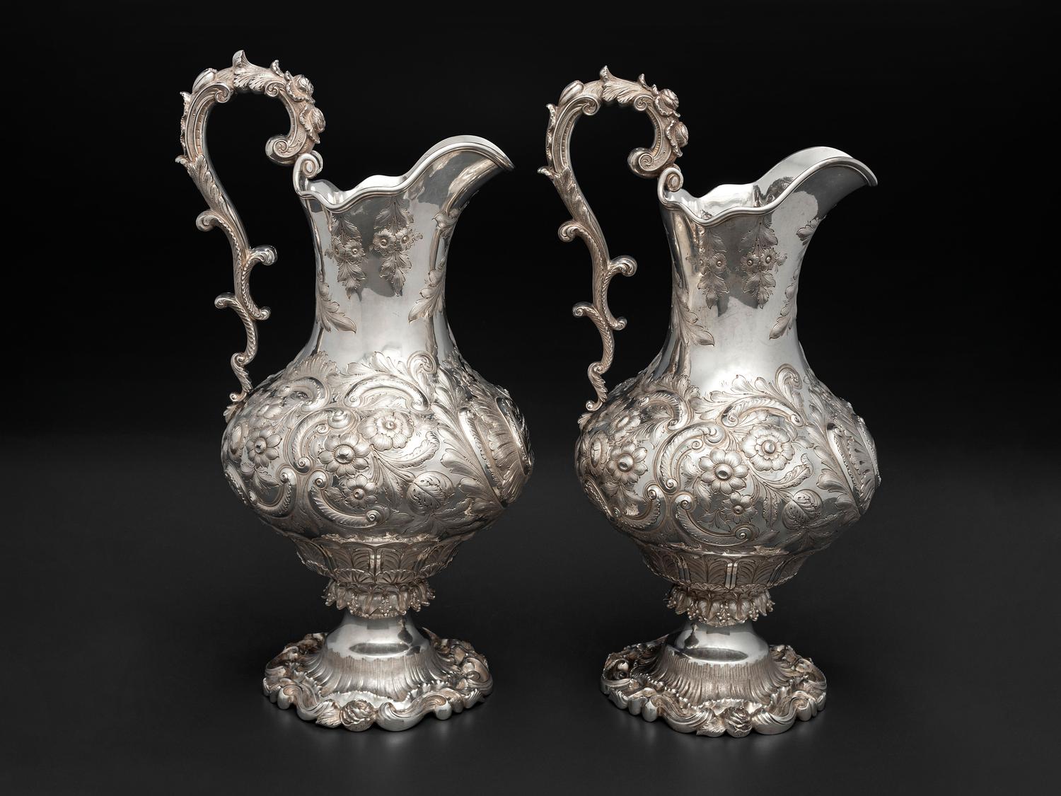 A Pair of American Repousse Silver Presentation Pitchers