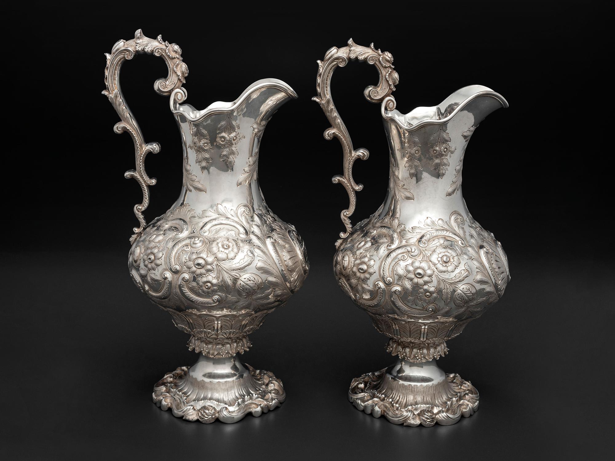 A Pair of American Repousse Silver Presentation Pitchers