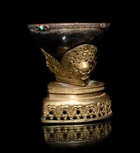 A Tibetan Semi-Precious Stone Inlaid Gilt Bronze and Silver Skull Cup, Kapala