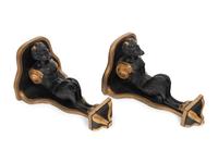 A Pair of Continental Ebonized and Parcel Gilt Wood Figural Brackets