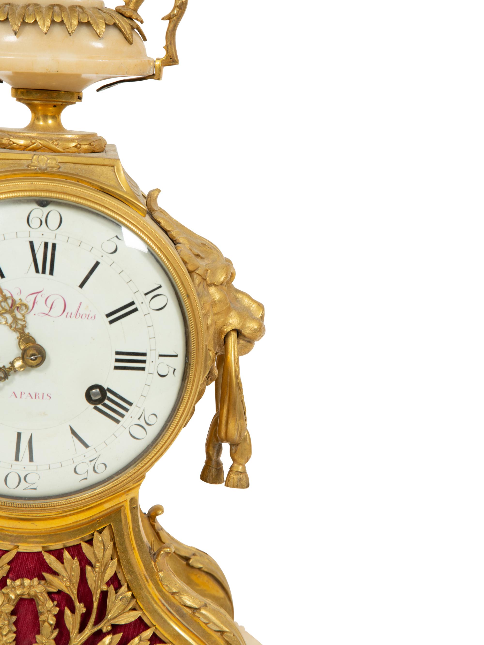 A Louis XVI Gilt Bronze and Marble Mantel Clock
