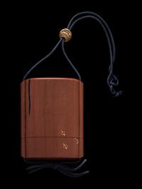 A Japanese Gold, Black and Red Lacquered Cedar Wood Three-Case Inro