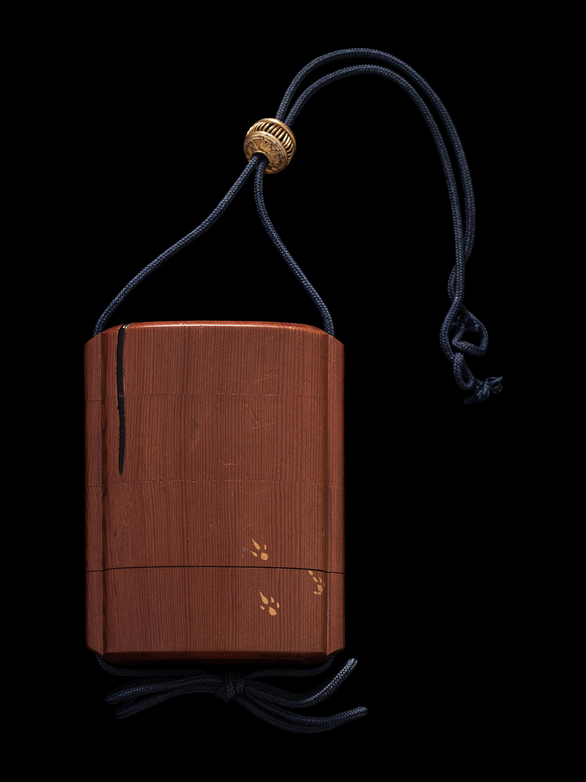 A Japanese Gold, Black and Red Lacquered Cedar Wood Three-Case Inro