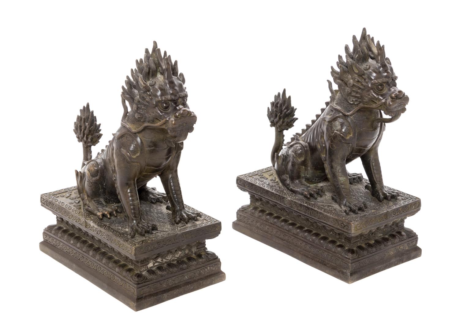 A Pair of Chinese Bronze Xiezhi Height of each 10 1/2 inches. — 20TH CENTURY