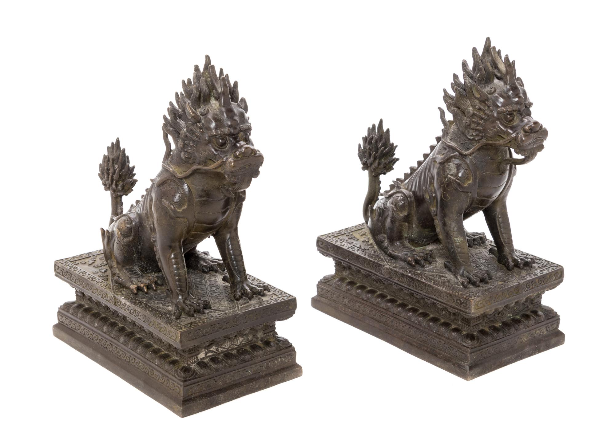 A Pair of Chinese Bronze Xiezhi Height of each 10 1/2 inches. — 20TH CENTURY