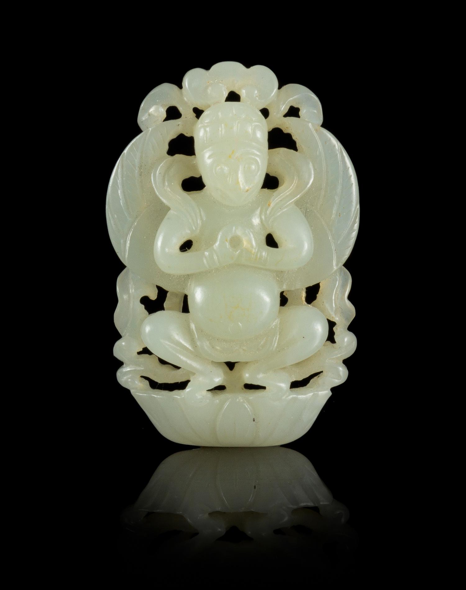 A Carved Jade Pendant Length 2 inches.