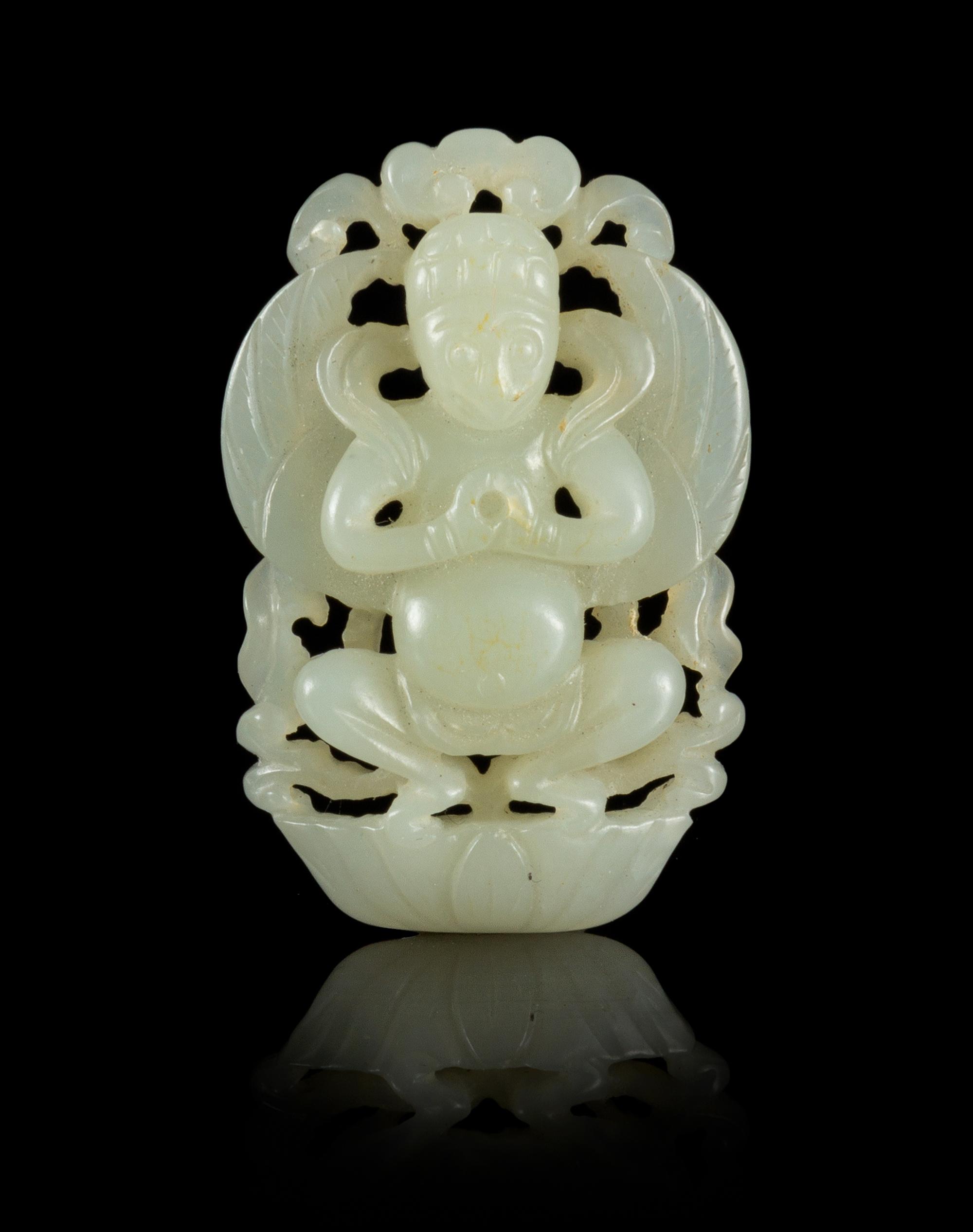 A Carved Jade Pendant Length 2 inches.