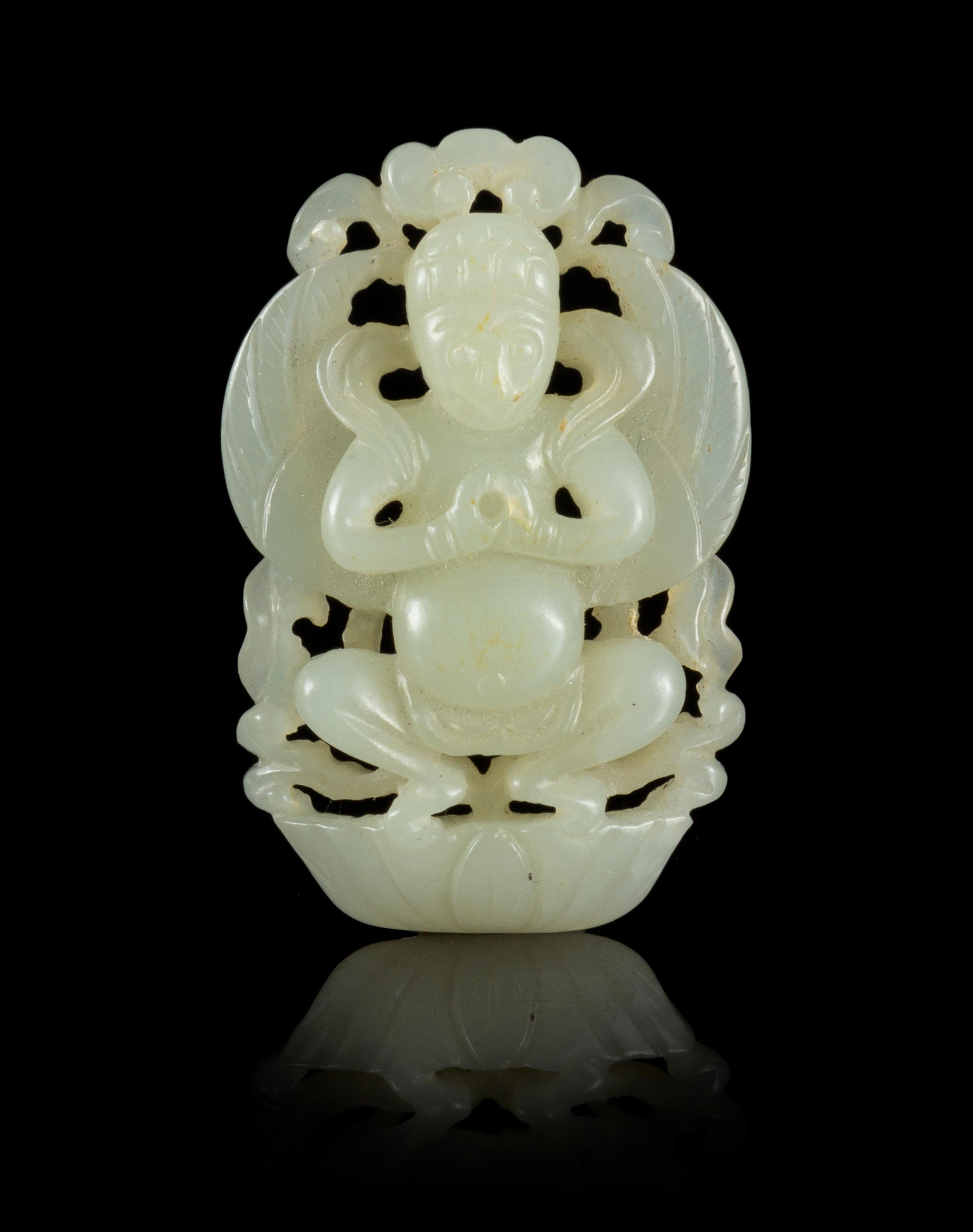 A Carved Jade Pendant Length 2 inches.