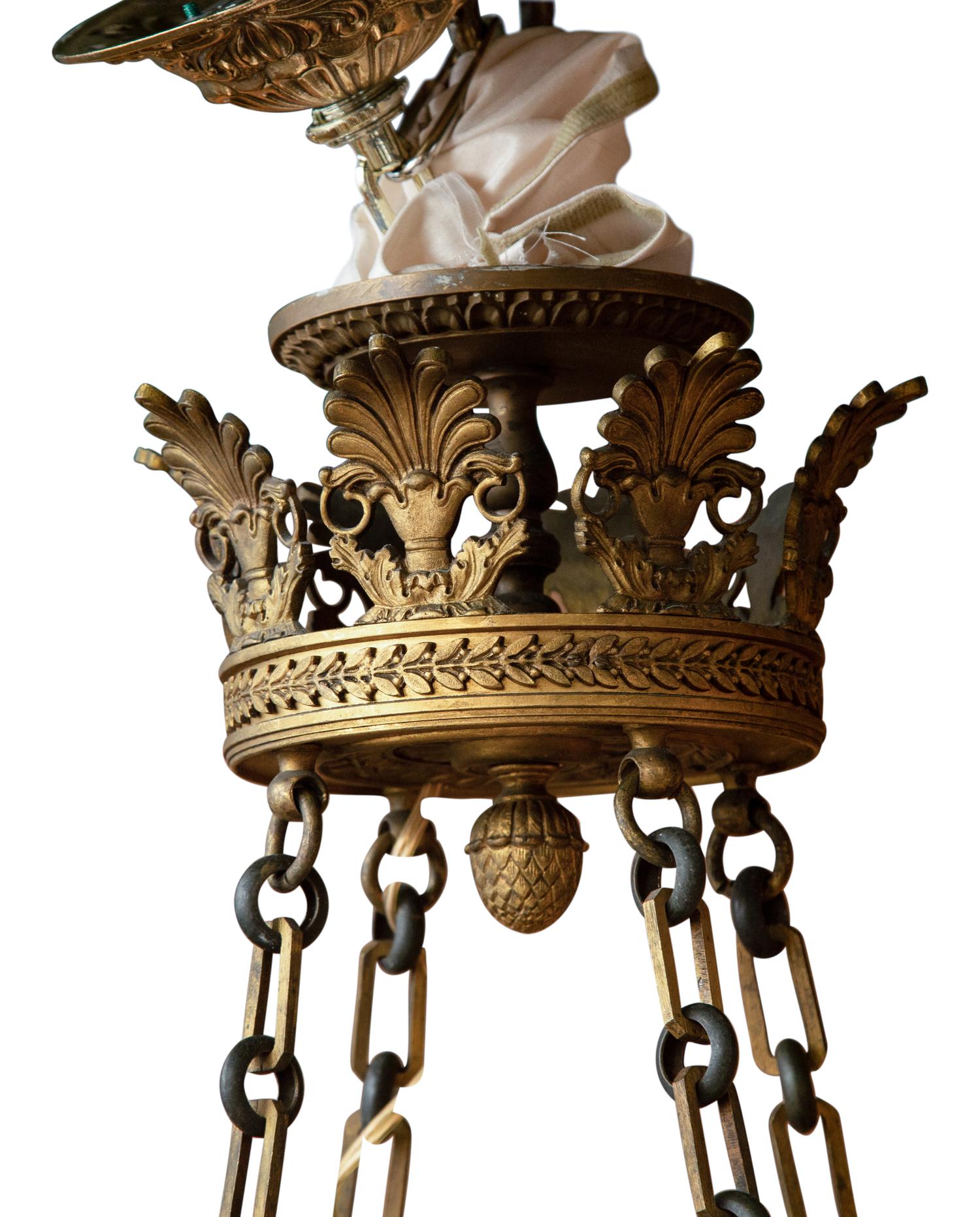 An Empire Style Patinated and Gilt Bronze Eight-Light Chandelier
