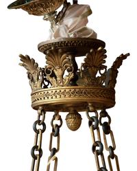 An Empire Style Patinated and Gilt Bronze Eight-Light Chandelier