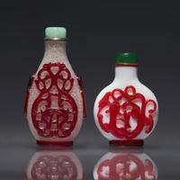 Two Chinese Ruby Overlay Glass Snuff Bottles, Qing Dynasty, 18th/19th Century — 清中期 套寶石紅料鼻煙壺兩支