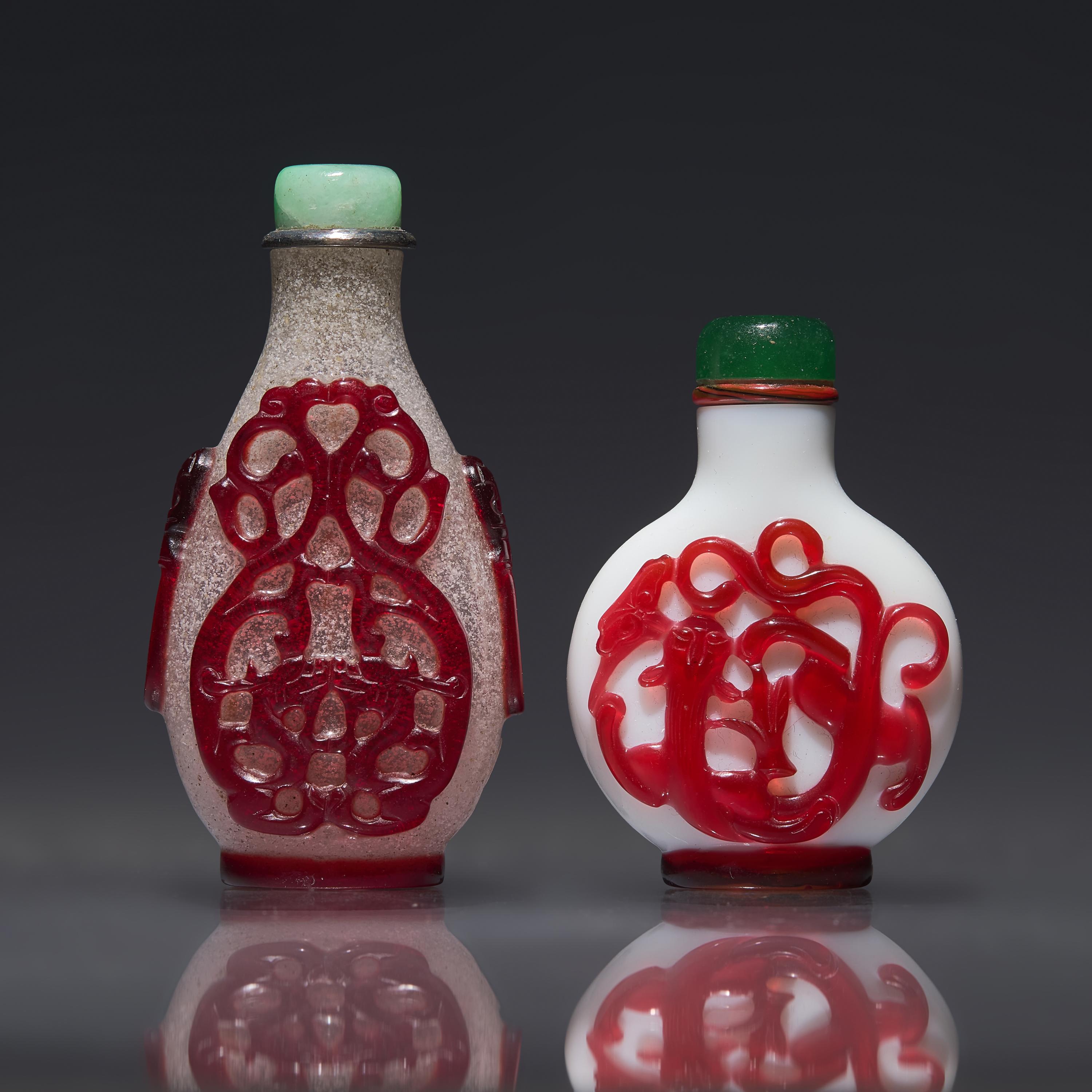 Two Chinese Ruby Overlay Glass Snuff Bottles, Qing Dynasty, 18th/19th Century — 清中期 套寶石紅料鼻煙壺兩支