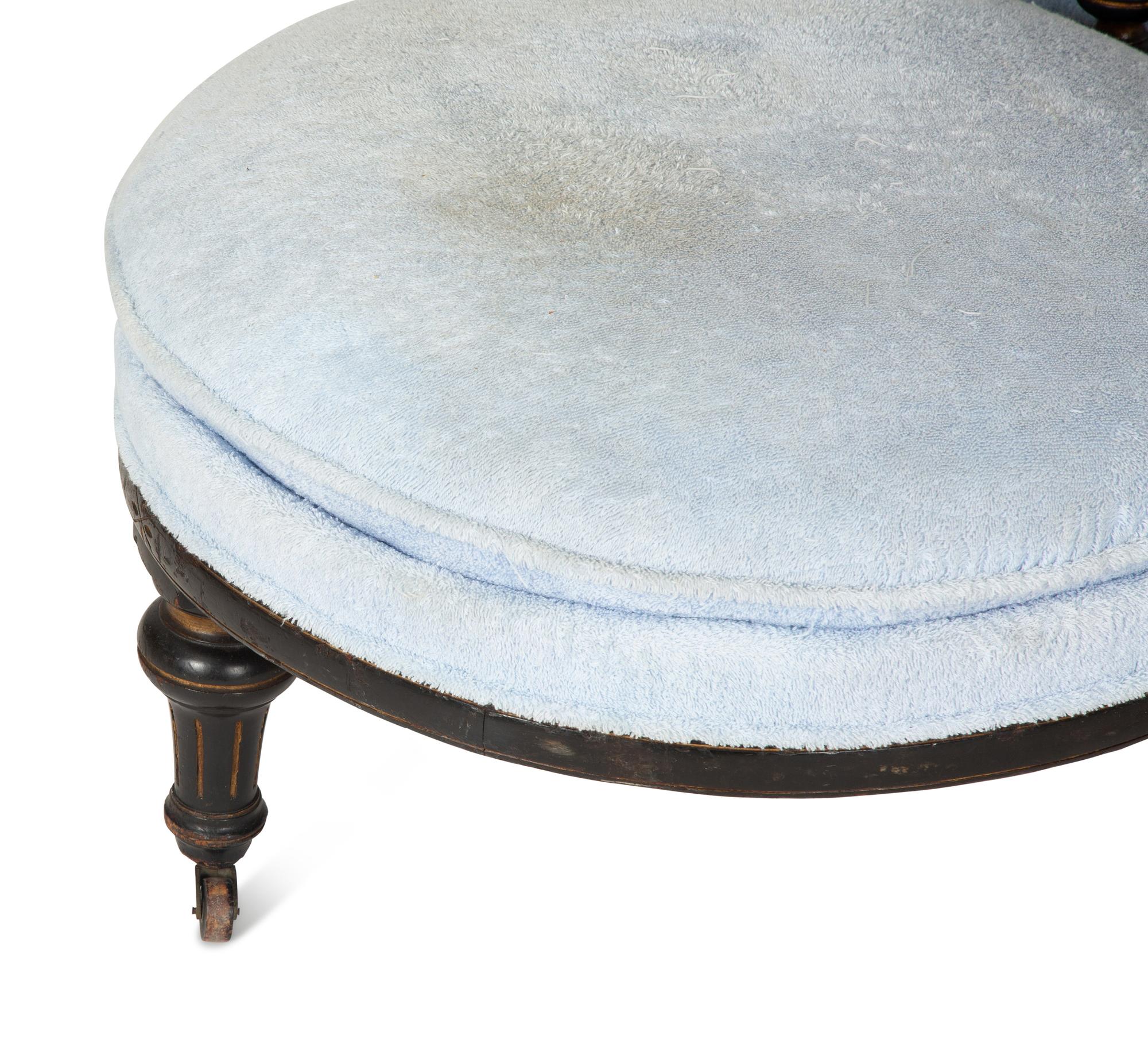 A Victorian Ebonized and Gilt Decorated Tête-à-Tête