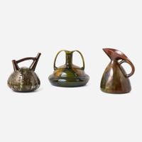 Three glazed earthenware jugs Christopher Dresser (English, 1834-1904), Ault Pottery (1887-1922) and Linthorpe Pottery Works (1879-1889), England, circa 1890 and 1879-1882 respectively