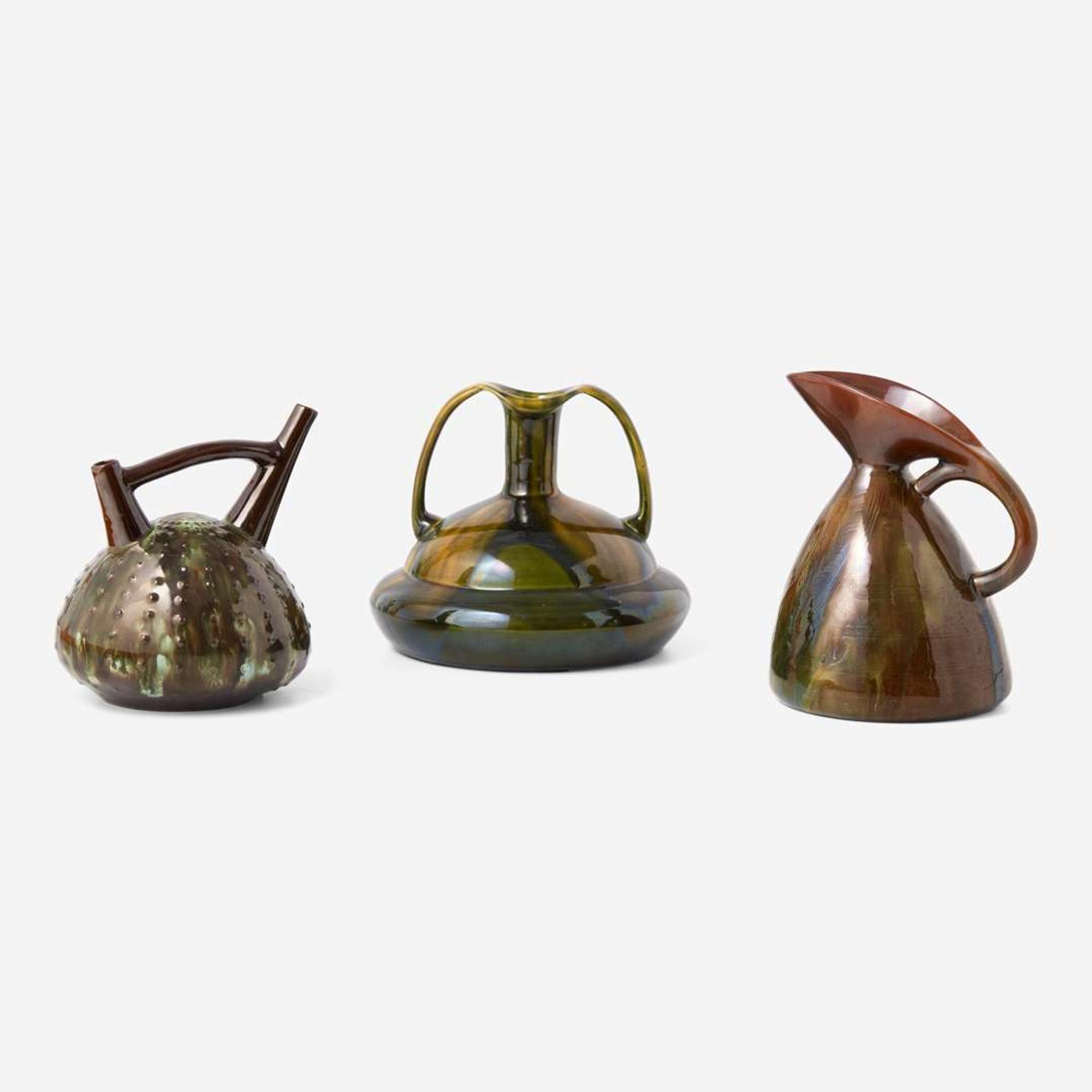 Three glazed earthenware jugs Christopher Dresser (English, 1834-1904), Ault Pottery (1887-1922) and Linthorpe Pottery Works (1879-1889), England, circa 1890 and 1879-1882 respectively