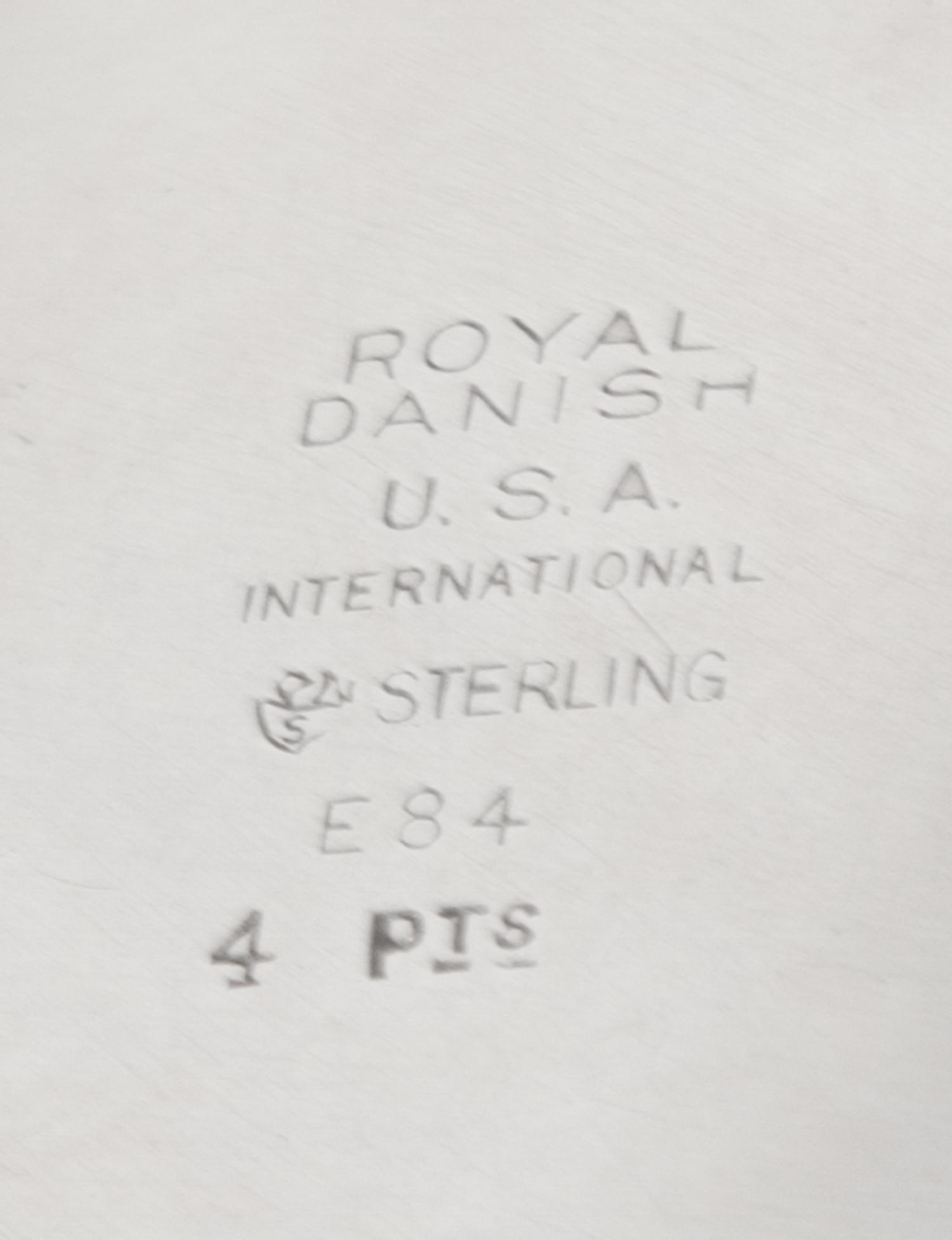 An American Silver Pitcher, International Silver Co., Meriden, CT, in the Royal Danish pattern, of baluster form, the handle having ban
