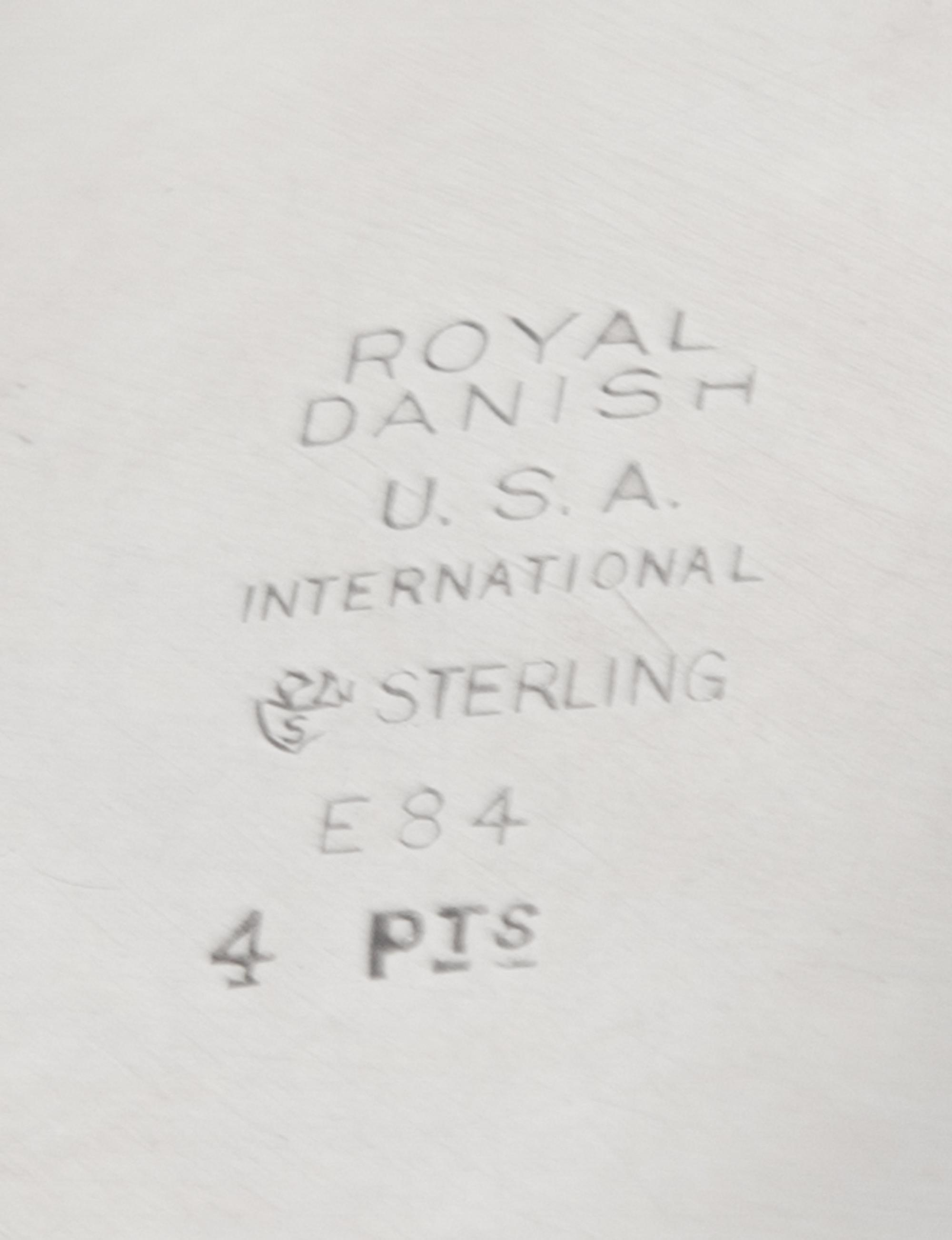An American Silver Pitcher, International Silver Co., Meriden, CT, in the Royal Danish pattern, of baluster form, the handle having ban