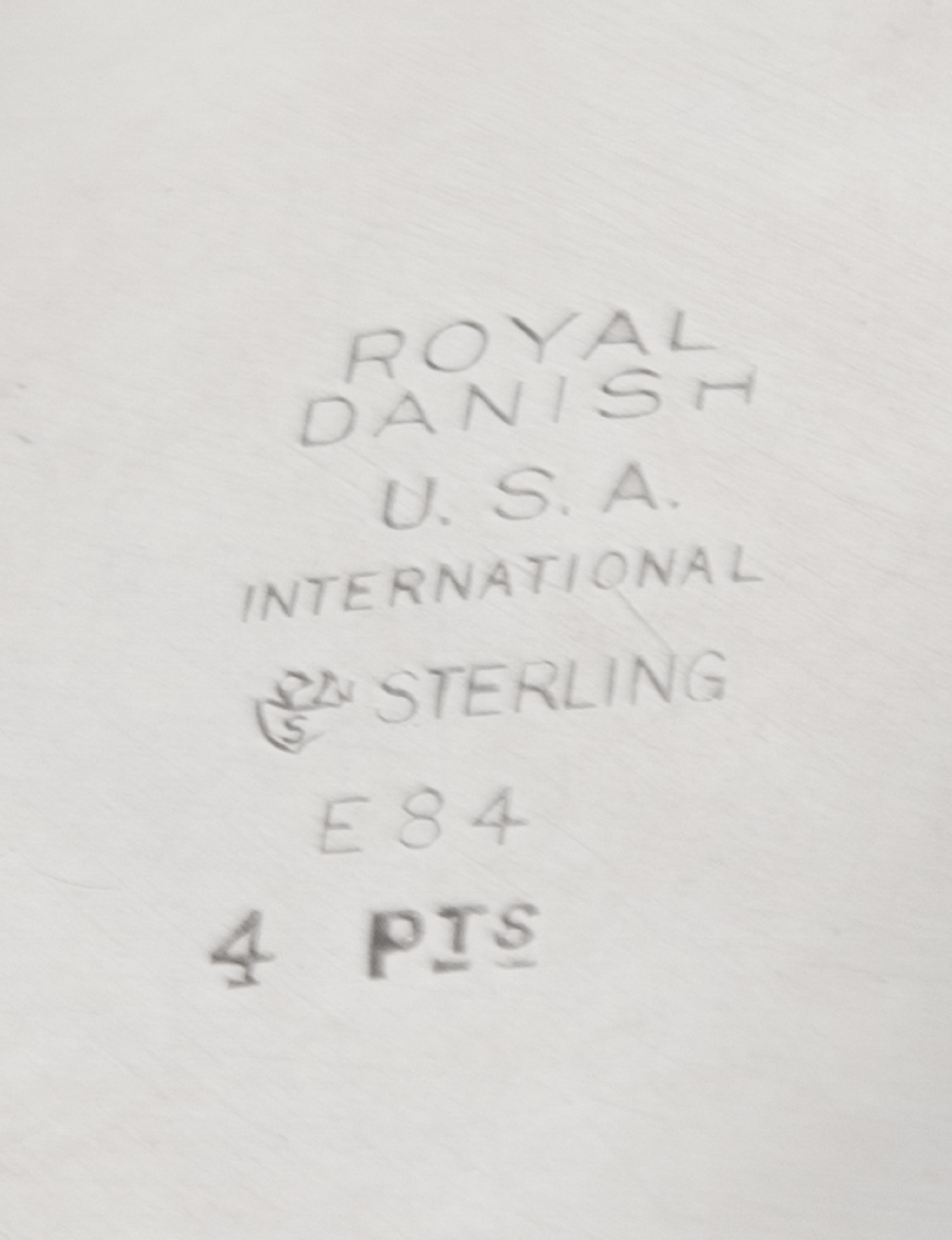 An American Silver Pitcher, International Silver Co., Meriden, CT, in the Royal Danish pattern, of baluster form, the handle having ban