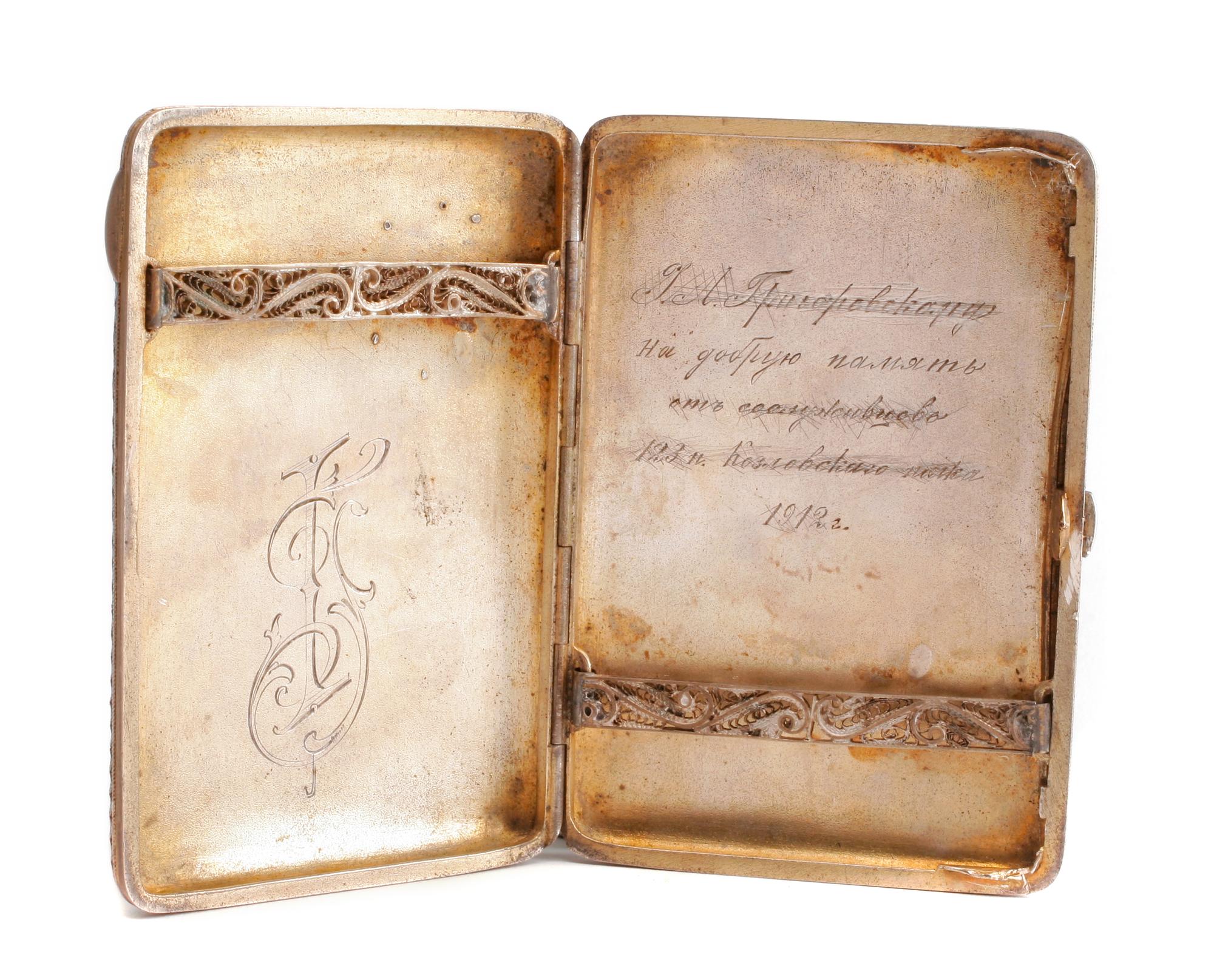A Russian Enameled Silver Cigarette Case, Mark of Grigory Sbitnev, Moscow, Late 19th/Early 20th Century, the case worked to show polych