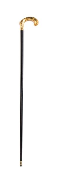 An American Chased Gold Handled Cane, Redlich & Co., Width of handle 4 3/4 x length overall 36 1/4 inches.