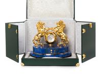 A Gilt Metal and Lapis Lazuli Veneered Clock Height 12 1/2 inches. — MODERN