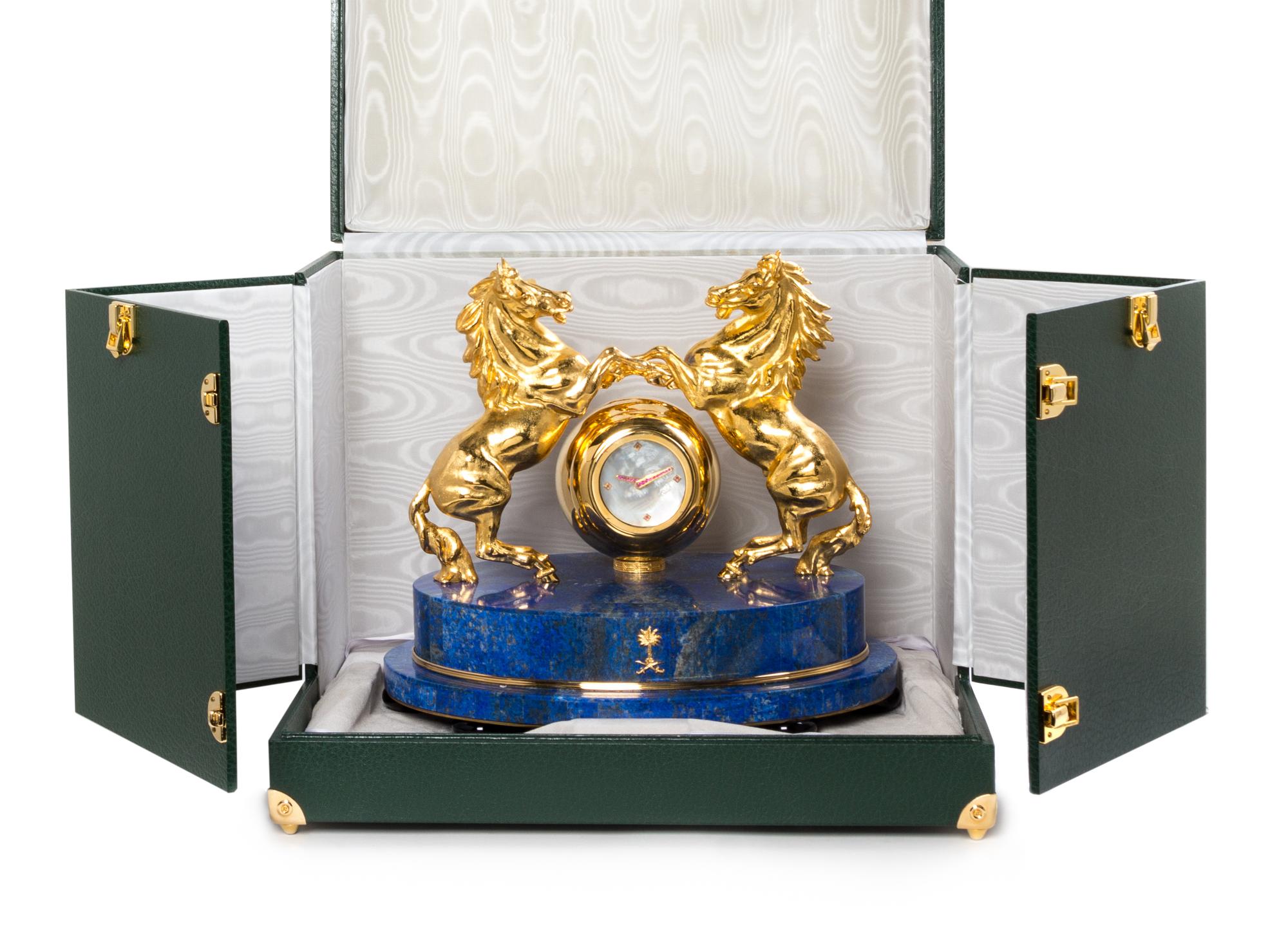 A Gilt Metal and Lapis Lazuli Veneered Clock Height 12 1/2 inches. — MODERN