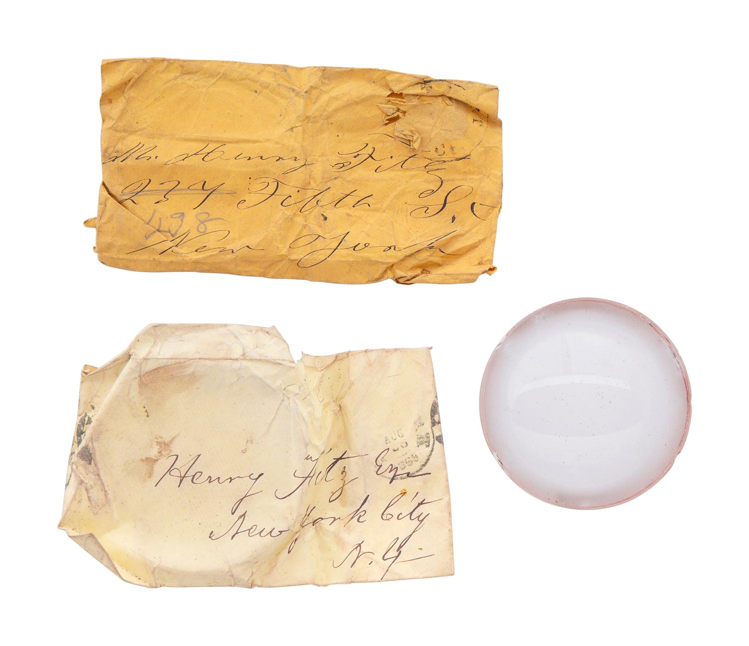 A collection of lenses and partial manuscript list referencing locations where Fitz telescopes would be sent, found in the workshop of George W. Fitz, Peconic, New York.