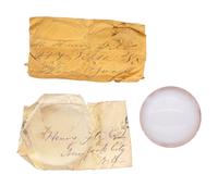 A collection of lenses and partial manuscript list referencing locations where Fitz telescopes would be sent, found in the workshop of George W. Fitz, Peconic, New York.