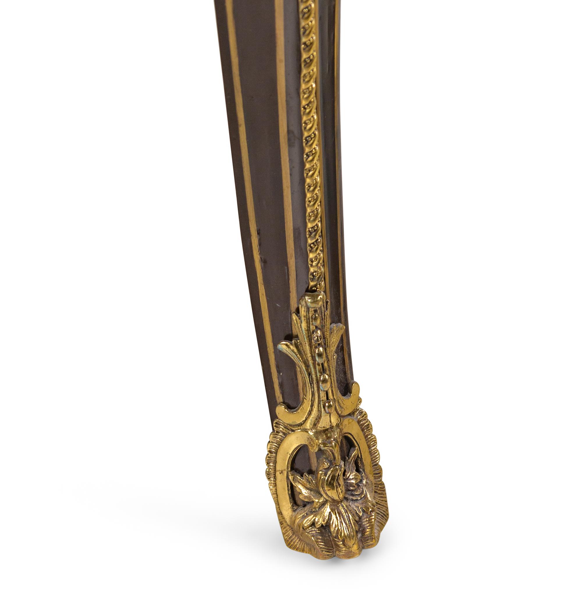 A Napoleon III Gilt Bronze Mounted Ebonized Marble-Top Center Table