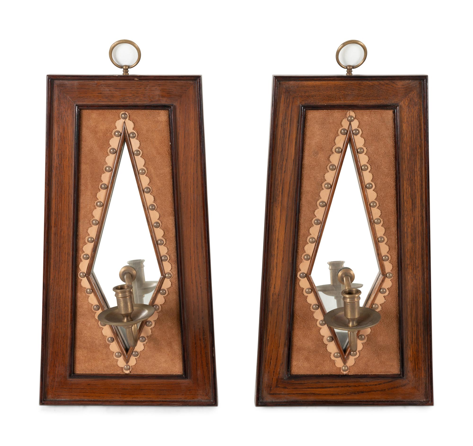 A Pair of Brass Mounted Suede-Inset Oak Mirrored Sconces