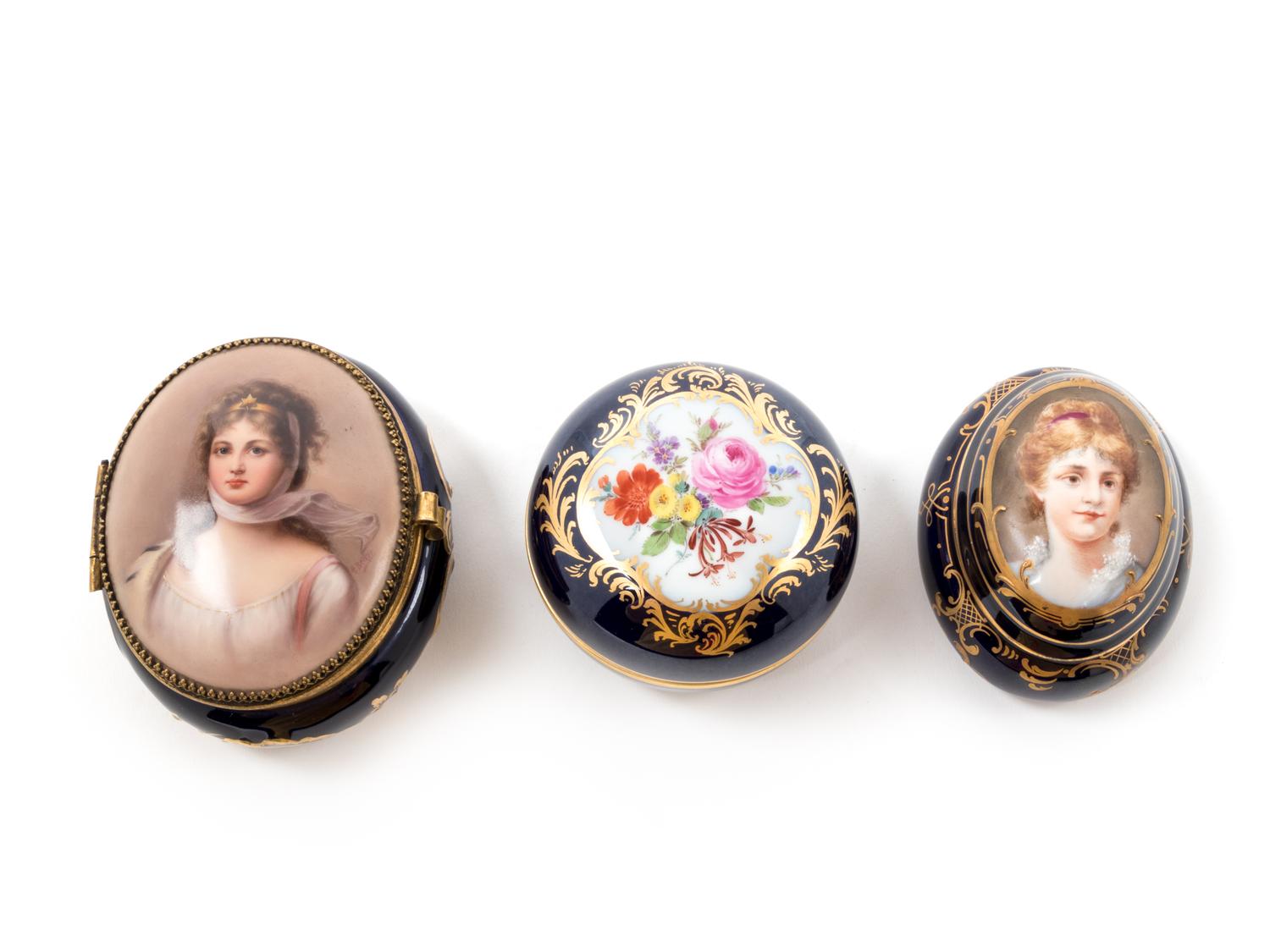 Three Continental Painted and Parcel Gilt Porcelain Boxes