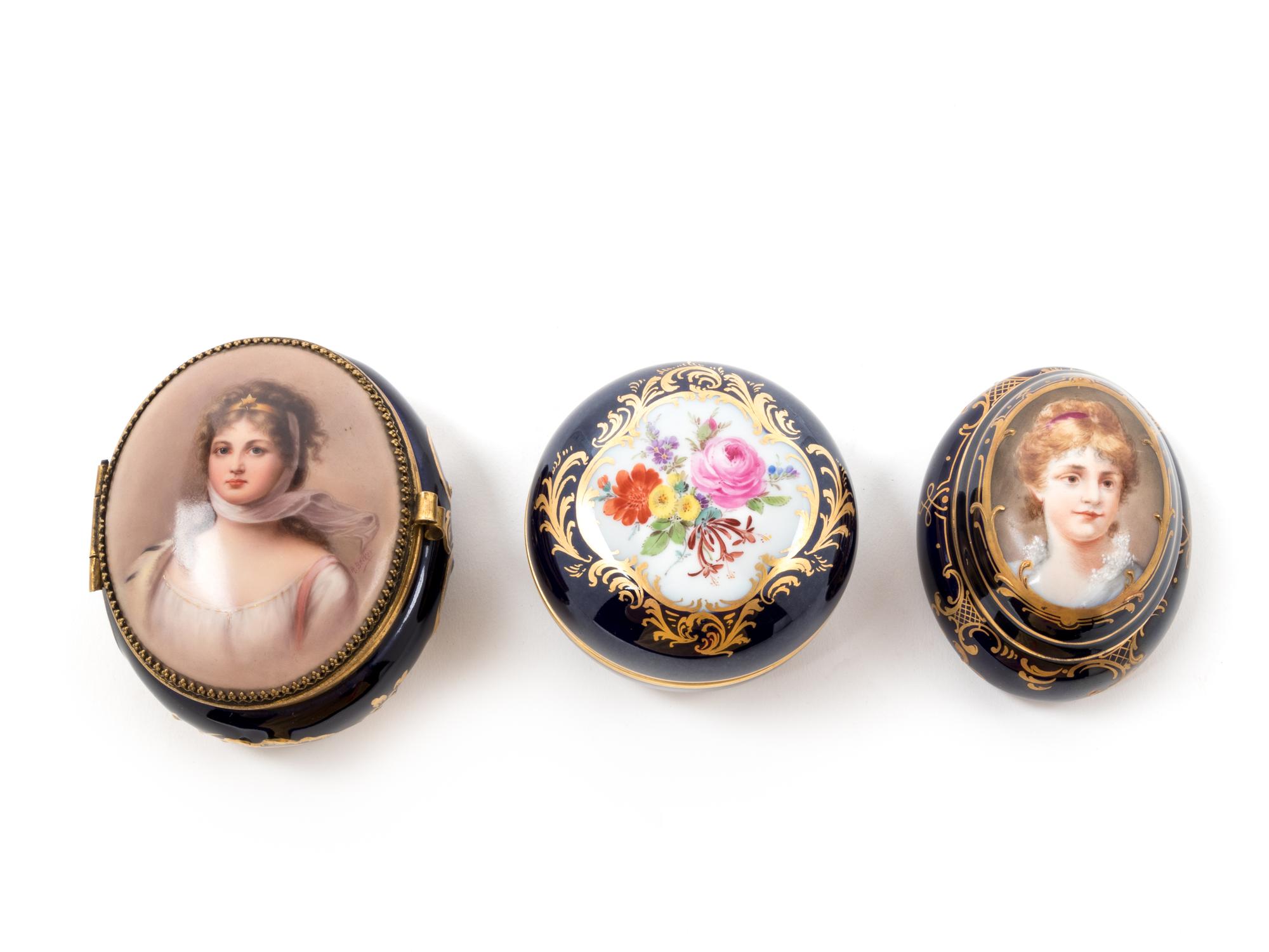 Three Continental Painted and Parcel Gilt Porcelain Boxes