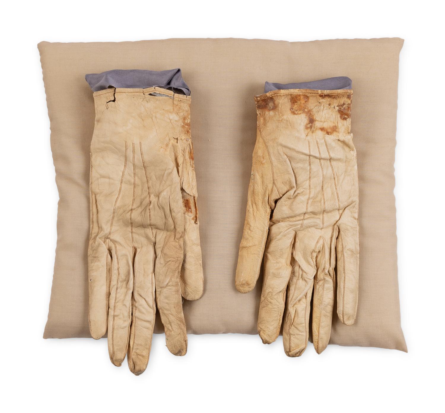 [LINCOLN ASSASSINATION]. A pair of stained leather gloves carried by President Abraham Lincoln at Ford's Theatre on the night of his assassination, 14 April 1865.
