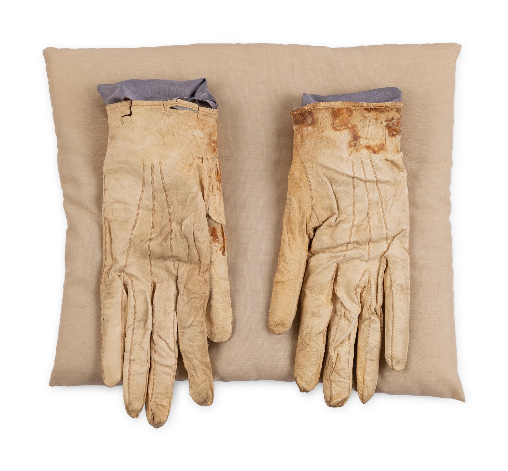 [LINCOLN ASSASSINATION]. A pair of stained leather gloves carried by President Abraham Lincoln at Ford's Theatre on the night of his assassination, 14 April 1865.