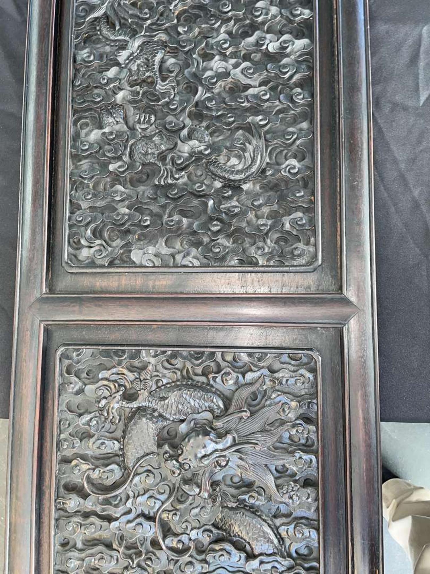 A Chinese carved hardwood six-panel “Dragons” screen 硬木浮雕龙纹六开屏风