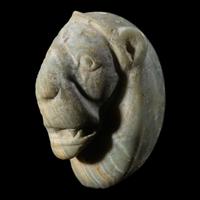 A Mesopotamian Green Stone Seal with a Lion Head