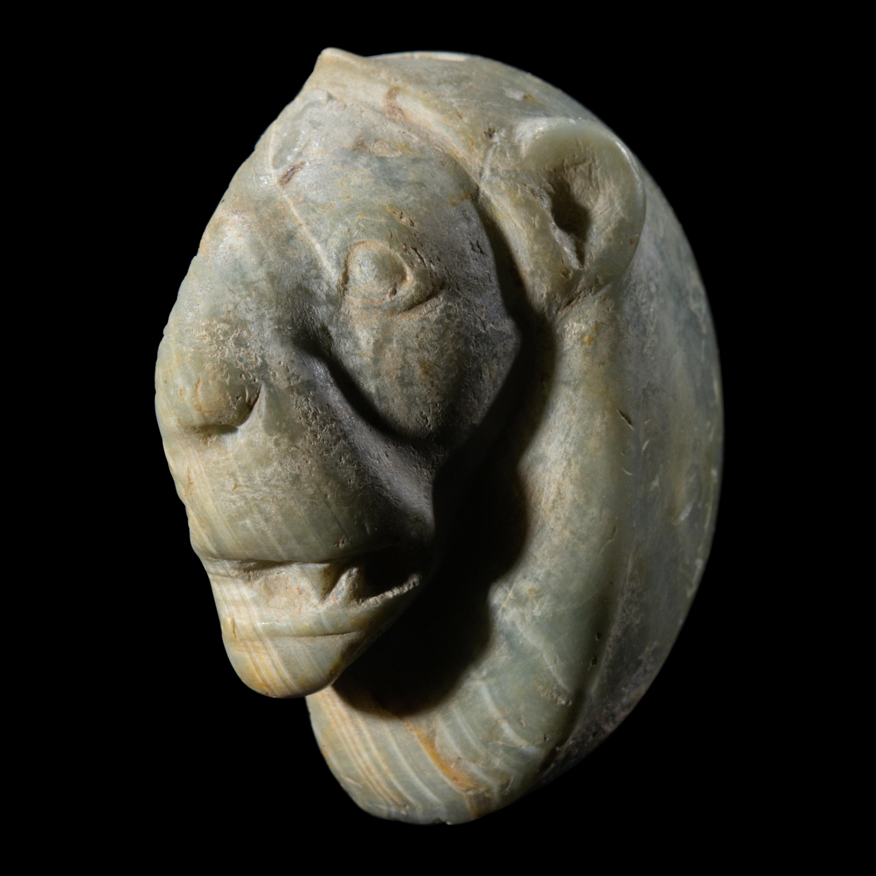 A Mesopotamian Green Stone Seal with a Lion Head