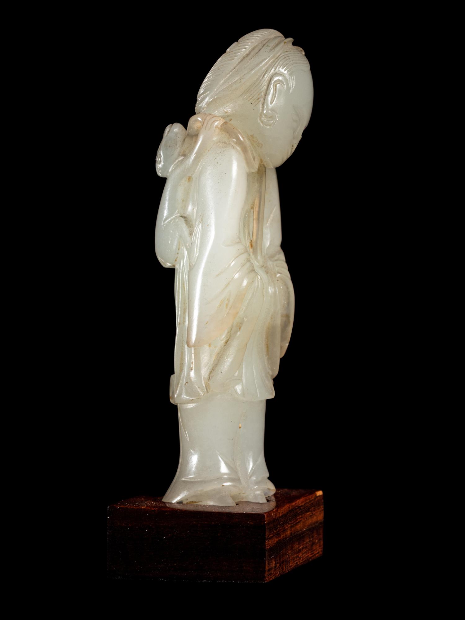 Two Carved Pale Celadon Jade Figures