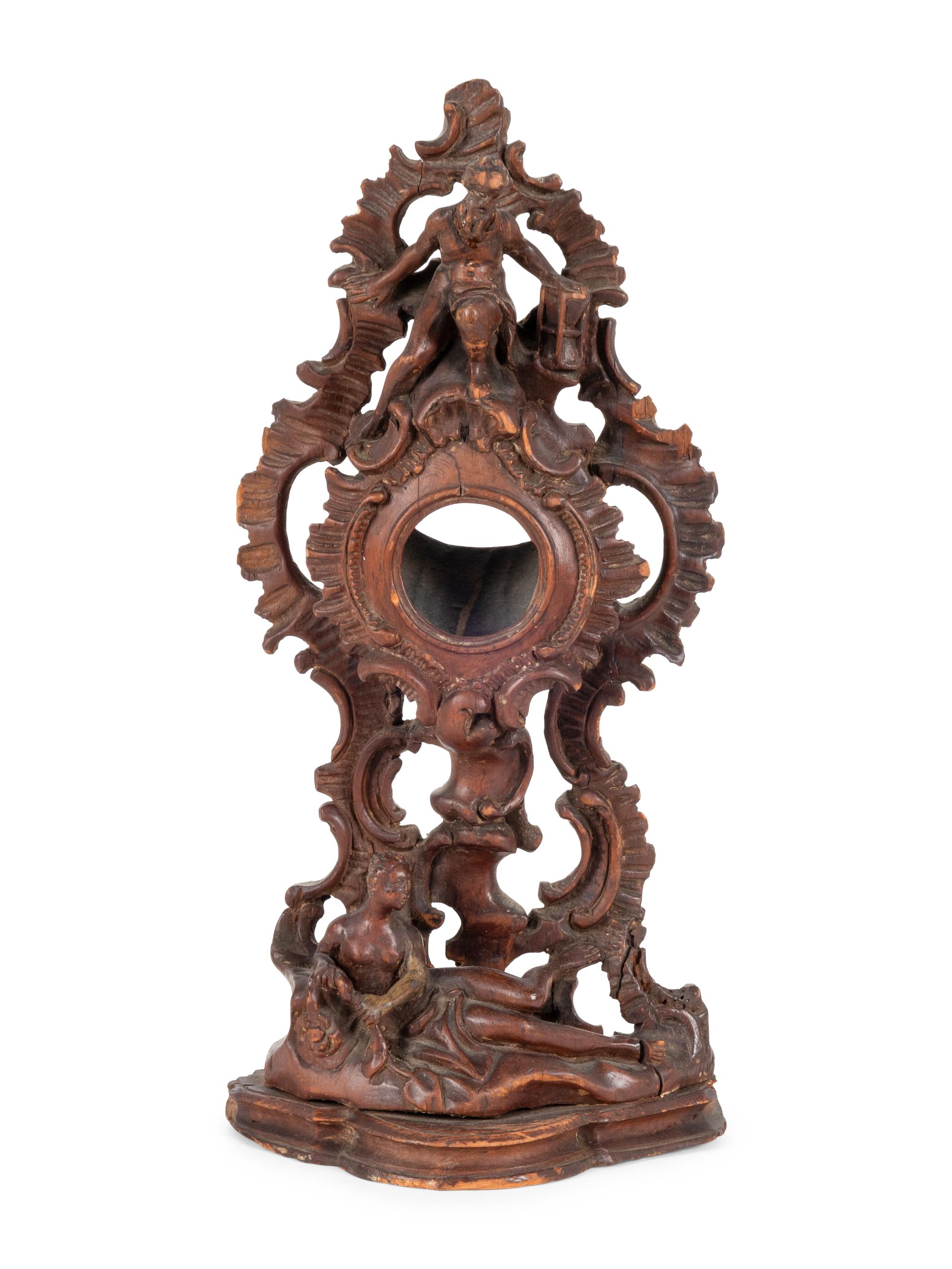 A Continental Rococo Style Carved Fruitwood Watch Stand