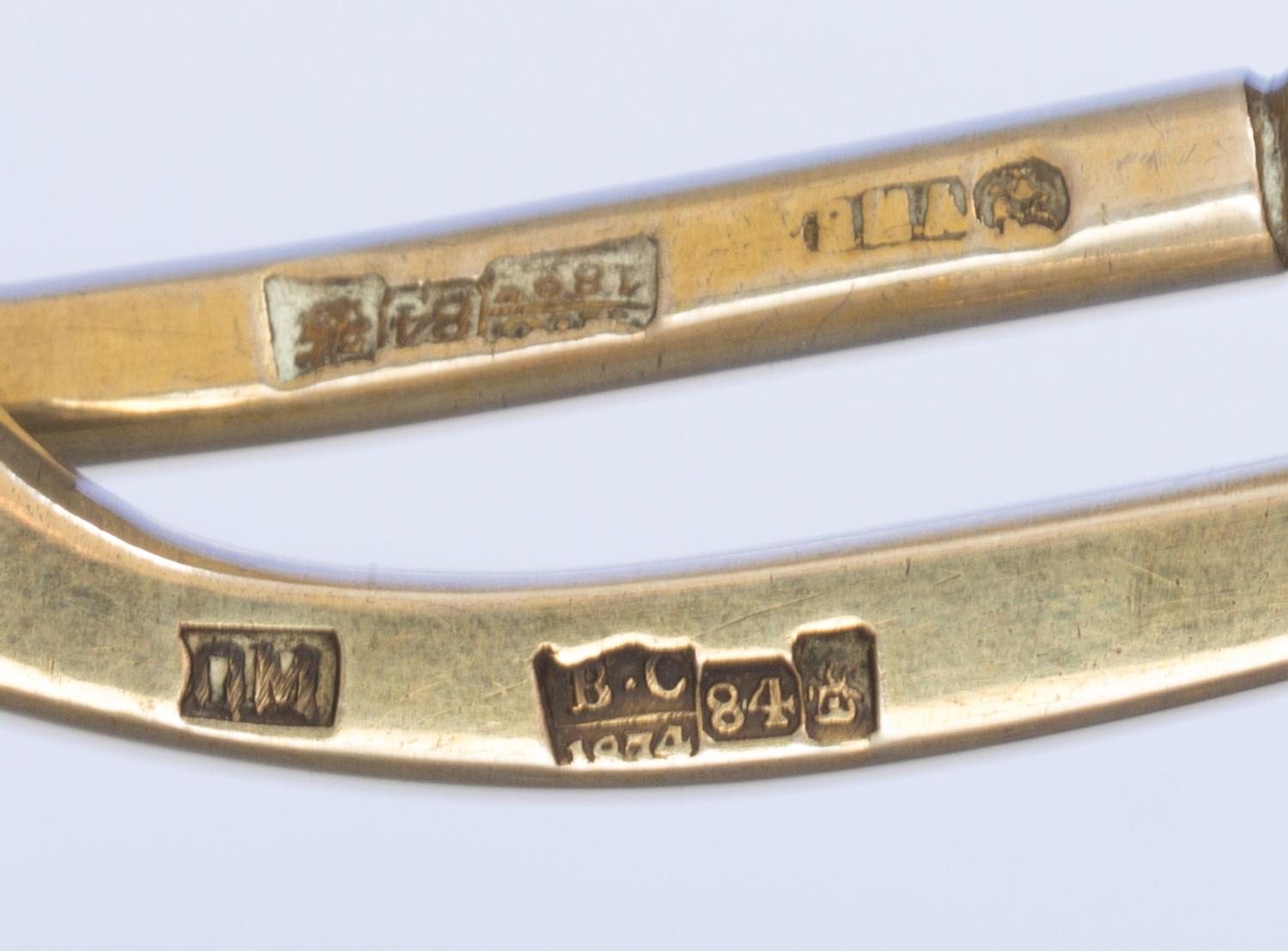 Two Russian Silver-Gilt and Niello Spoons, Various makers, Moscow, 19th century, each having a twist handle, the underside of the bowls