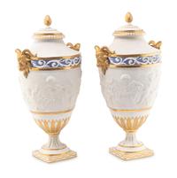 A Pair of Sèvres Style Biscuit Porcelain Vases and Covers
