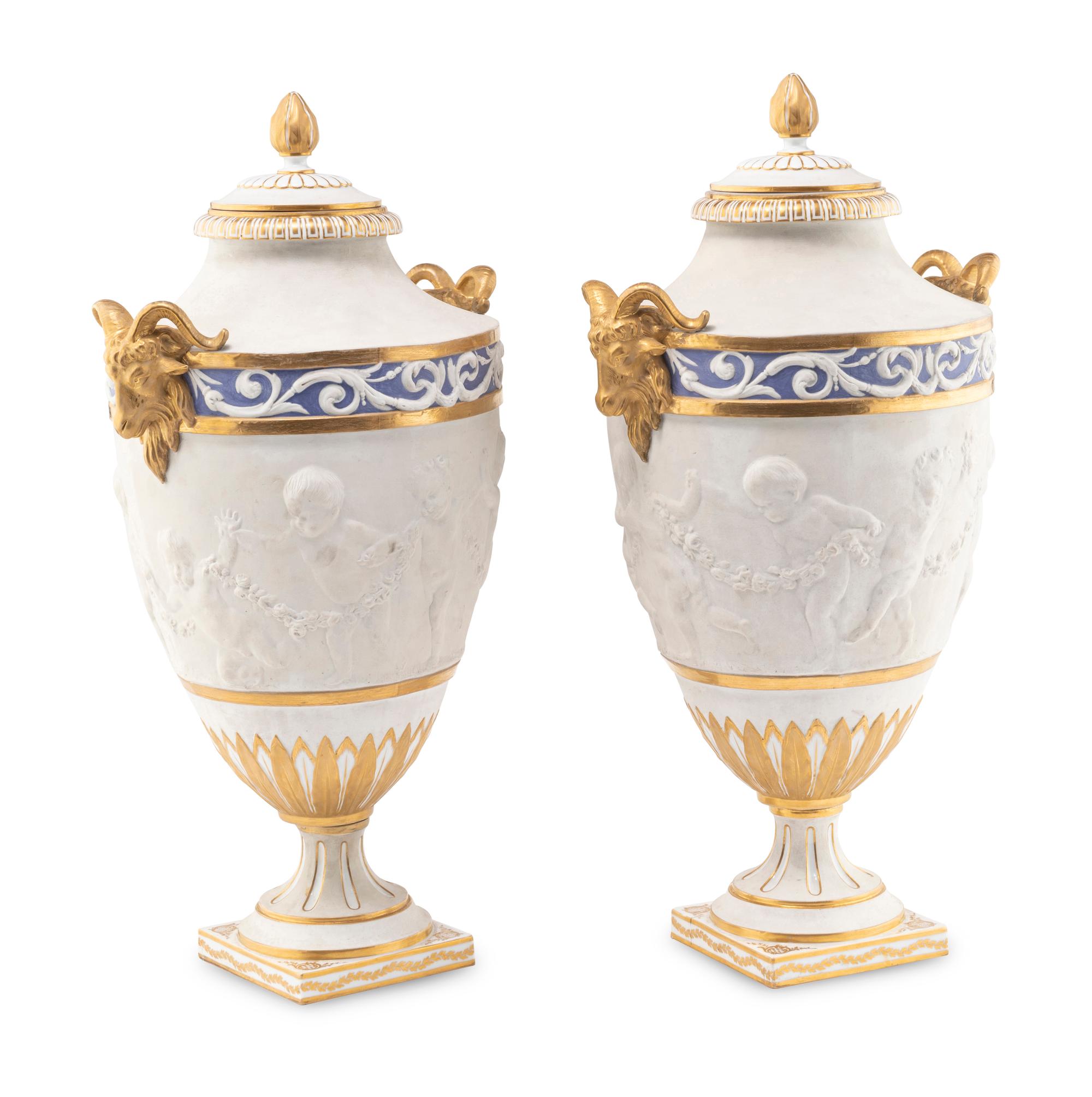 A Pair of Sèvres Style Biscuit Porcelain Vases and Covers