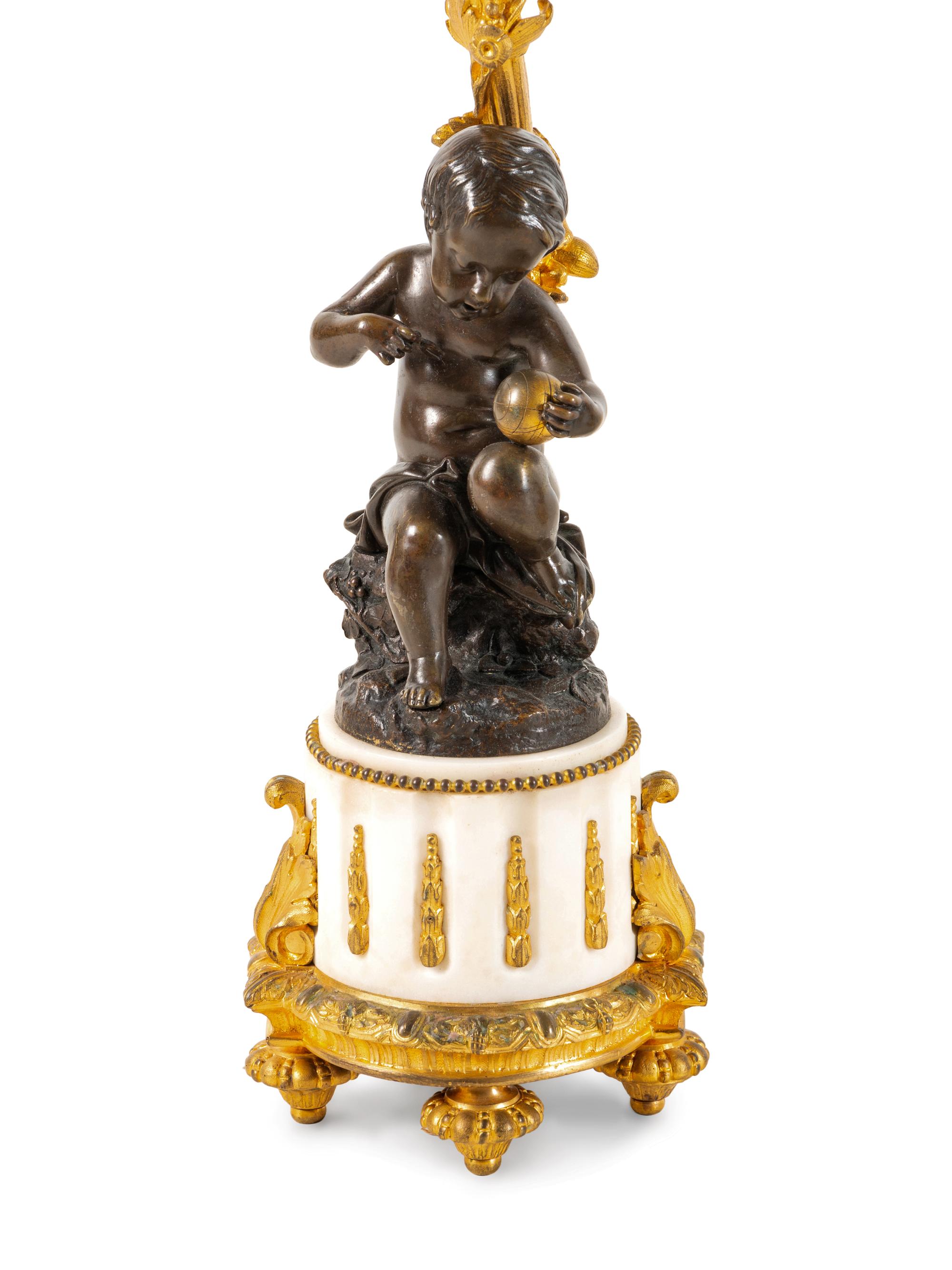 A Pair of Louis XVI Style Gilt and Patinated Bronze Six-Light Figural Candelabra