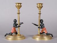 A Pair of Blackamoor Candlesticks, Height 7 1/4 inches.